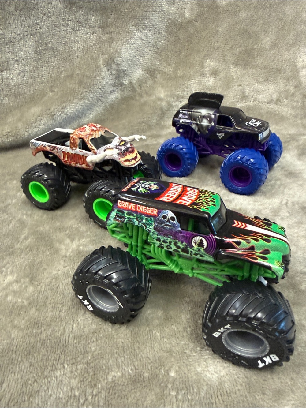 Lot of 3 Monster Jam Trucks Mohawk Warrior, Grave Digger, & Zombie G